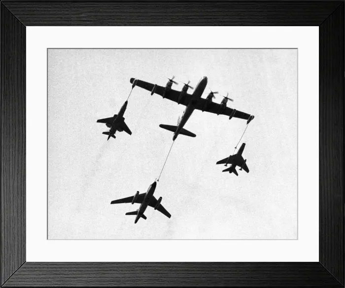 Framed Print : A United States Air Force tanker refuelling fighter planes during a demonstration Framed Print : A United States Air Force tanker refuelling fighter planes during a demonstration