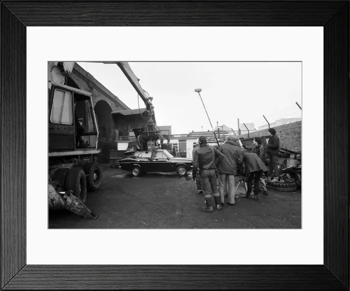 Framed Print : UB40 filming a video film in a scrapyard. The video film will feature songs from their Framed Print : UB40 filming a video film in a scrapyard. The video film will feature songs from their