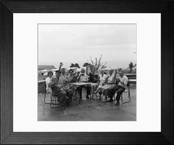 Framed Print : Holidaymakers enjoying a drink at Sandy Bay Caravan site, near Exmouth, Devon Framed Print : Holidaymakers enjoying a drink at Sandy Bay Caravan site, near Exmouth, Devon