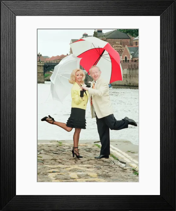 Framed Print : Paul Daniels, magician, pictured with wife Debbie McGee, at the riverside, in York Framed Print : Paul Daniels, magician, pictured with wife Debbie McGee, at the riverside, in York