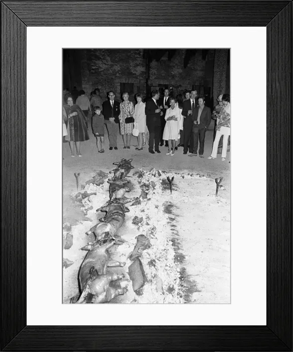 Framed Print : Eating Out, Majorca, Spain, August 1971. Pigs being roasted on spit Framed Print : Eating Out, Majorca, Spain, August 1971. Pigs being roasted on spit