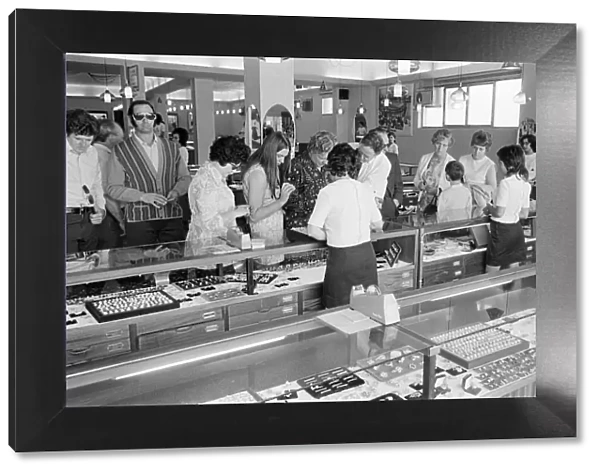 Looking for bargains, souvenir shopping, Majorca, Spain, August 1971