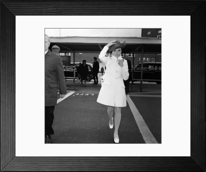 Framed Print : Leaving Heathrow Airport for Corfu is actress Joan Collins Framed Print : Leaving Heathrow Airport for Corfu is actress Joan Collins