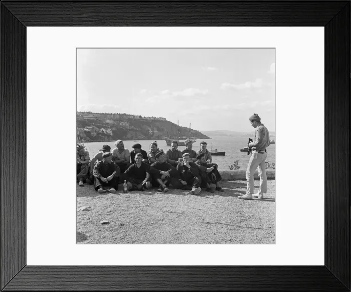 Framed Print : A man takes a photo of a group of men at Brixham Harbour, Devon. 12th April 1957 Framed Print : A man takes a photo of a group of men at Brixham Harbour, Devon. 12th April 1957
