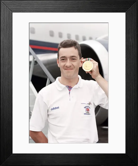 Framed Print : British cyclist Chris Boardman poses on arrival at Heathrow Airport as he returns home Framed Print : British cyclist Chris Boardman poses on arrival at Heathrow Airport as he returns home
