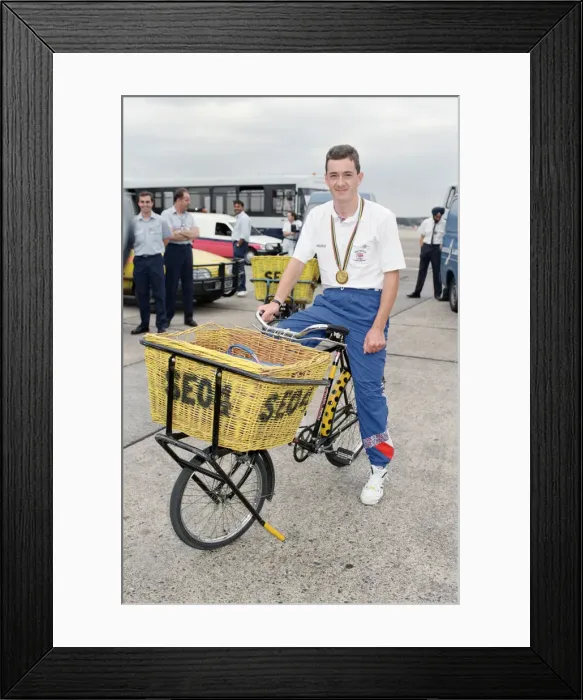 Framed Print : British cyclist Chris Boardman poses on arrival at Heathrow Airport as he returns home Framed Print : British cyclist Chris Boardman poses on arrival at Heathrow Airport as he returns home