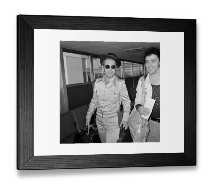 Framed Print : Elton John arriving at Heathrow Airport, from Los Angeles Framed Print : Elton John arriving at Heathrow Airport, from Los Angeles