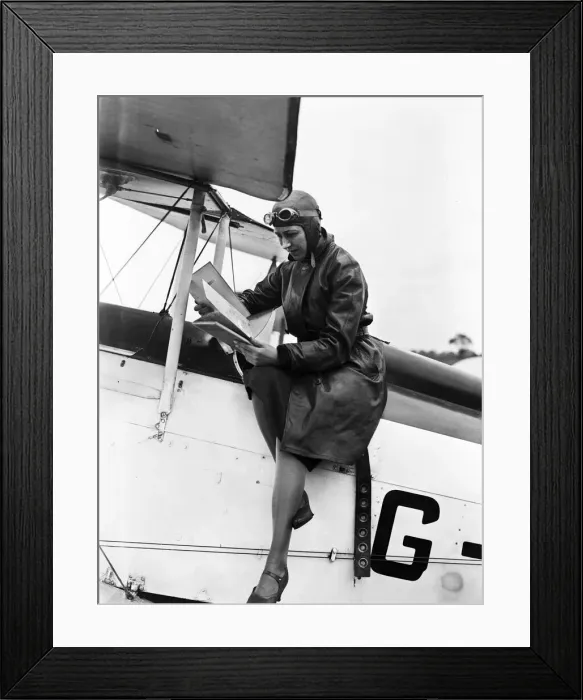 Framed Print : British aviator Amy Johnson pictured in the cockpit of her Gipsy Moth plane before taking