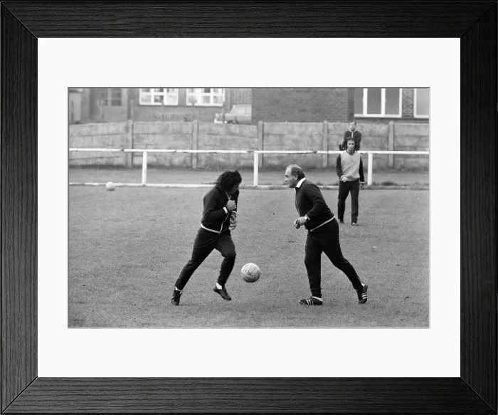 Framed Print : Alfredo Di Stefano shows his boys the Valencia FC how to do it as they train for their Framed Print : Alfredo Di Stefano shows his boys the Valencia FC how to do it as they train for their