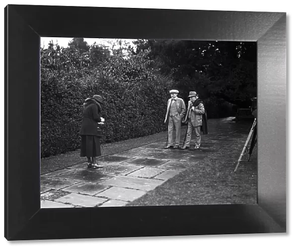 David Lloyd George at Chequers Court. Lady Greenwood taking a photograph of Mr Lloyd