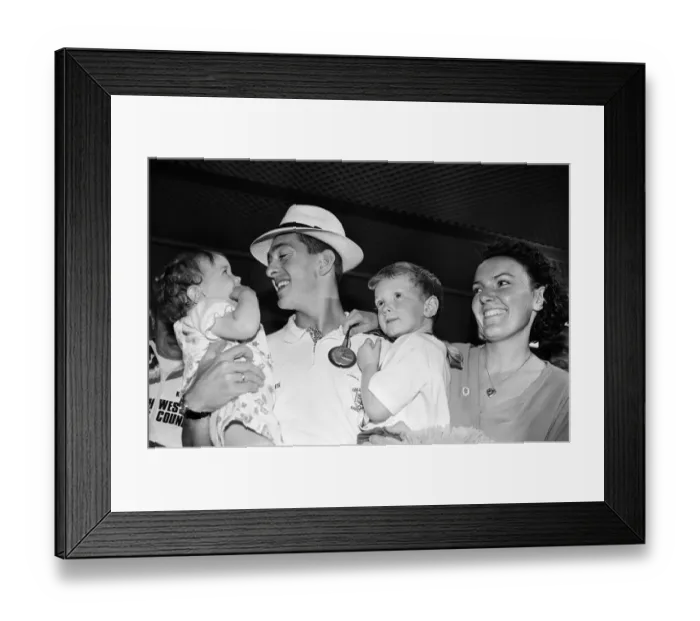 Framed Print : British cyclist Chris Boardman poses with his family on arrival at Manchester airport as Framed Print : British cyclist Chris Boardman poses with his family on arrival at Manchester airport as
