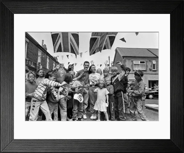 Framed Print : A street party held for British cyclist Chris Boardman following his return home from