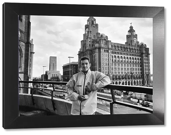 British cyclist Chris Boardman poses in front of the Royal Liver Building in Liverpool