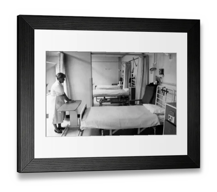 Framed Print : Alice Richards, cleans the empty Day Surgery Unit which is virtually closed due to lack