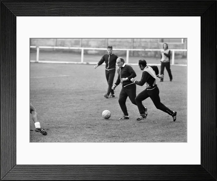 Framed Print : Alfredo Di Stefano shows his boys the Valencia FC how to do it as they train for their Framed Print : Alfredo Di Stefano shows his boys the Valencia FC how to do it as they train for their