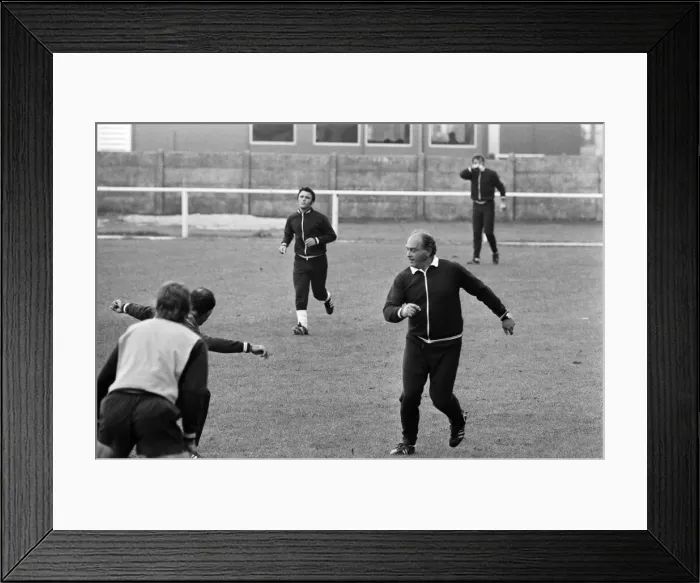 Framed Print : Alfredo Di Stefano shows his boys the Valencia FC how to do it as they train for their Framed Print : Alfredo Di Stefano shows his boys the Valencia FC how to do it as they train for their