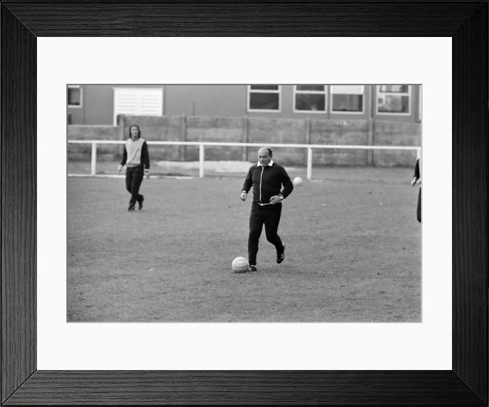 Framed Print : Alfredo Di Stefano shows his boys the Valencia FC how to do it as they train for their Framed Print : Alfredo Di Stefano shows his boys the Valencia FC how to do it as they train for their