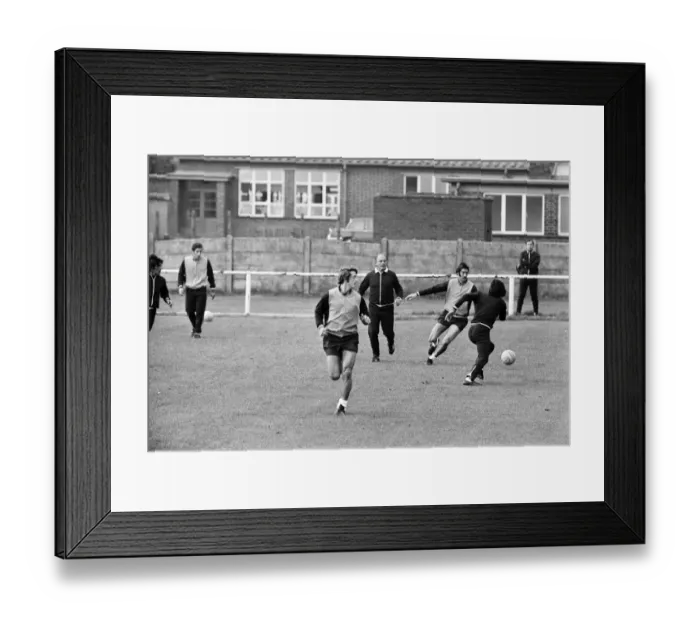 Framed Print : Alfredo Di Stefano shows his boys the Valencia FC how to do it as they train for their Framed Print : Alfredo Di Stefano shows his boys the Valencia FC how to do it as they train for their