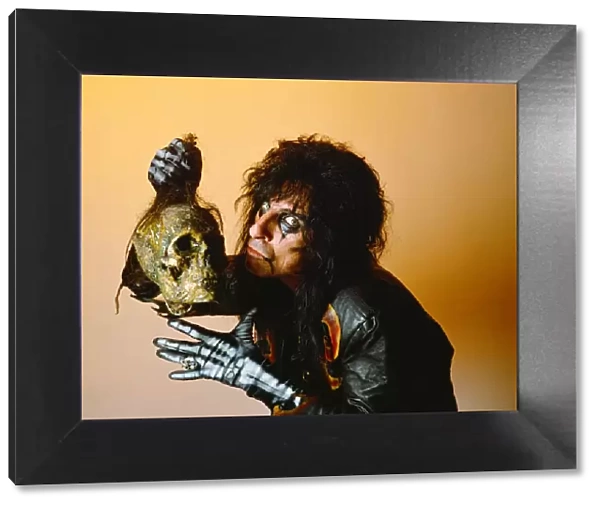 Alice Cooper holding a skeleton head. September 1987