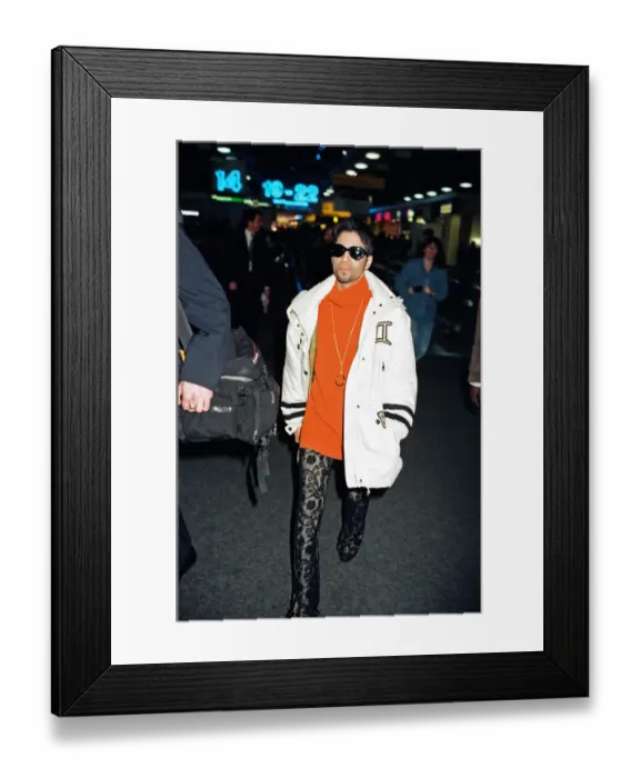 Framed Print : American pop star, the artist formerly known as Prince, leaving Heathrow Airport for New