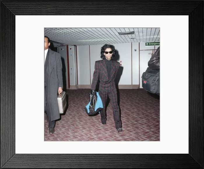 Framed Print : American pop star Prince arrives at Heathrow Airport in London. 19th January 1989 Framed Print : American pop star Prince arrives at Heathrow Airport in London. 19th January 1989