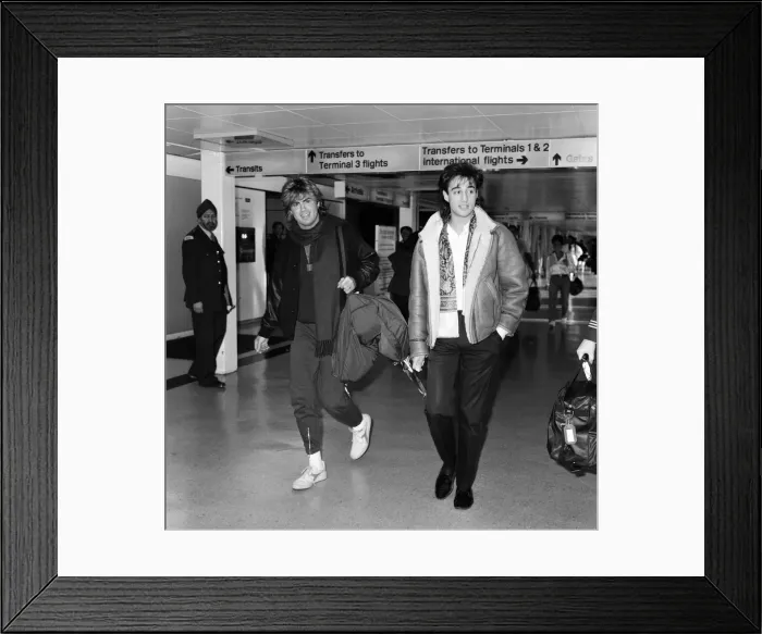 Framed Print : George Michael and Andrew Ridgeley of the pop group Wham!, arriving at Heathrow airport Framed Print : George Michael and Andrew Ridgeley of the pop group Wham!, arriving at Heathrow airport