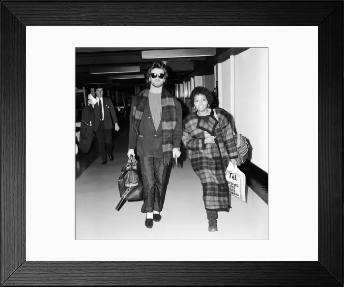 Framed Print : George Michael of the pop group Wham!, and girlfriend Pat Fernandez leaving Heathrow for Framed Print : George Michael of the pop group Wham!, and girlfriend Pat Fernandez leaving Heathrow for