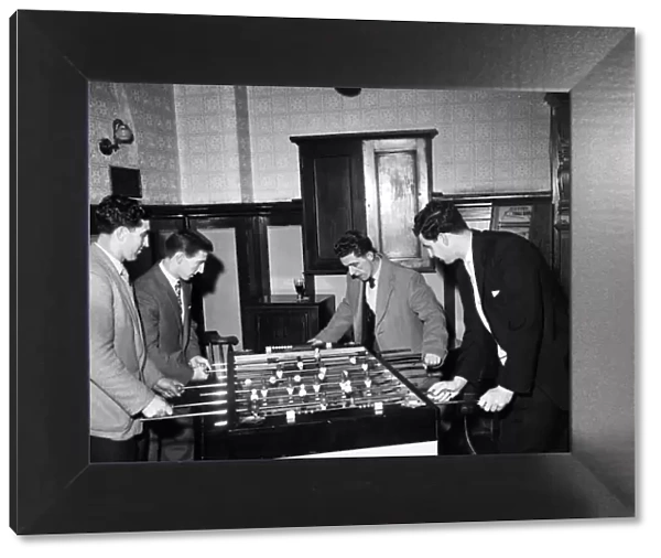 Tottenham Hotspur footballers enjoy a game of table football during a lunch time visit to