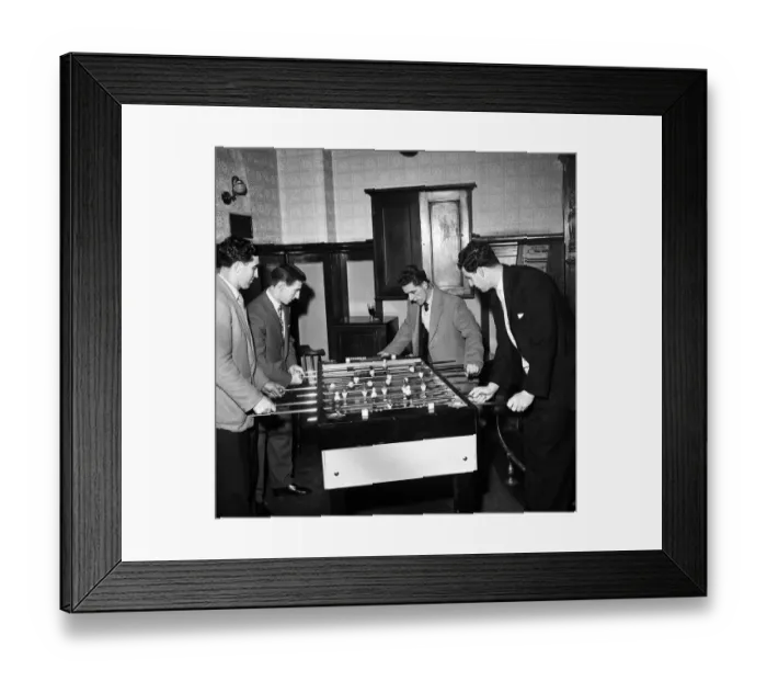 Framed Print : Tottenham Hotspur footballers enjoy a game of table football during a lunch time visit to