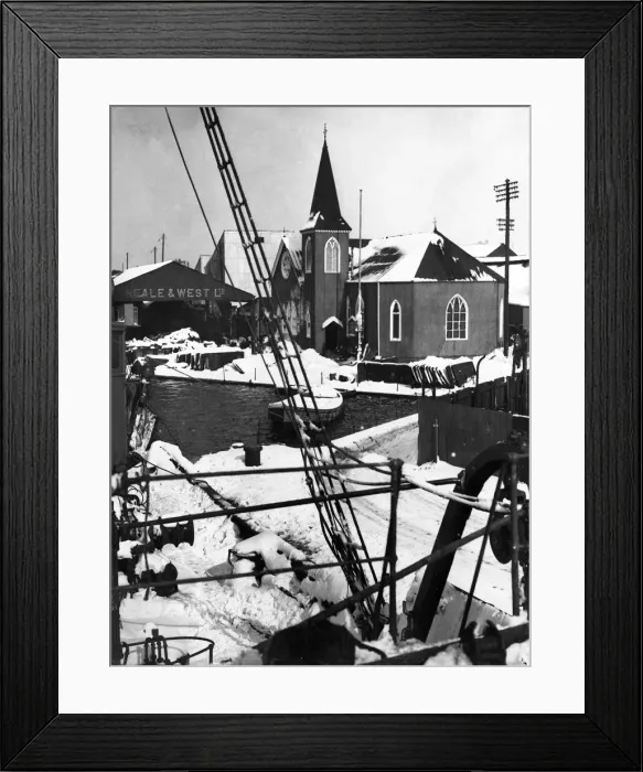 Framed Print : A corner of the Cardiff docks showing the Norwegian church covered in snow after a heavy
