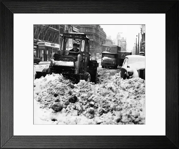 Framed Print : A snowplough busily clearing a path in St Marys Street Framed Print : A snowplough busily clearing a path in St Marys Street