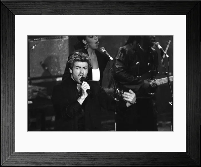 Framed Print : George Michael performing at the Stand by Me: AIDS Day Benefit concert at Wembley Arena Framed Print : George Michael performing at the Stand by Me: AIDS Day Benefit concert at Wembley Arena