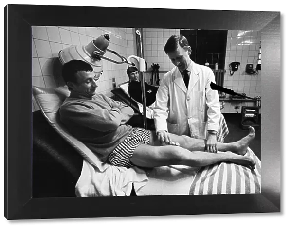 Mike Summerbee being examined (far left) whilst Colin Bell (right) awaits treatment