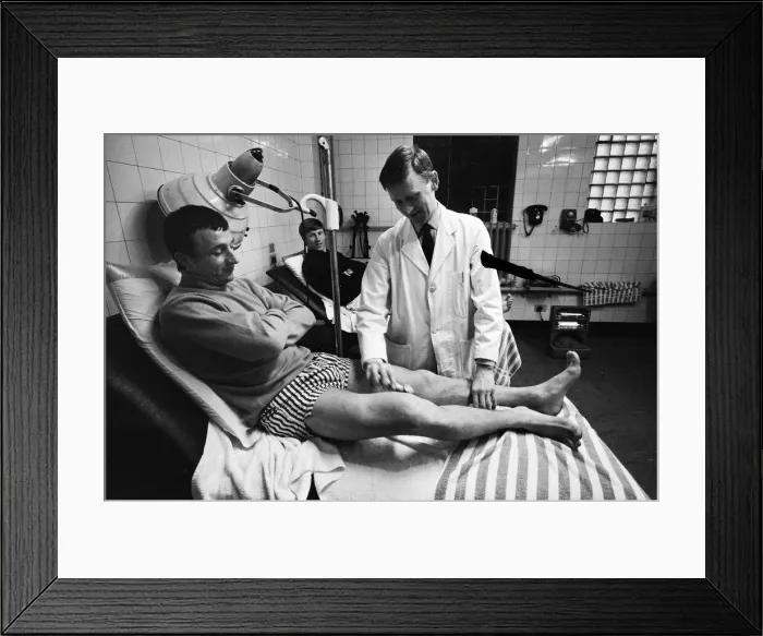 Framed Print : Mike Summerbee being examined (far left) whilst Colin Bell (right) awaits treatment Framed Print : Mike Summerbee being examined (far left) whilst Colin Bell (right) awaits treatment
