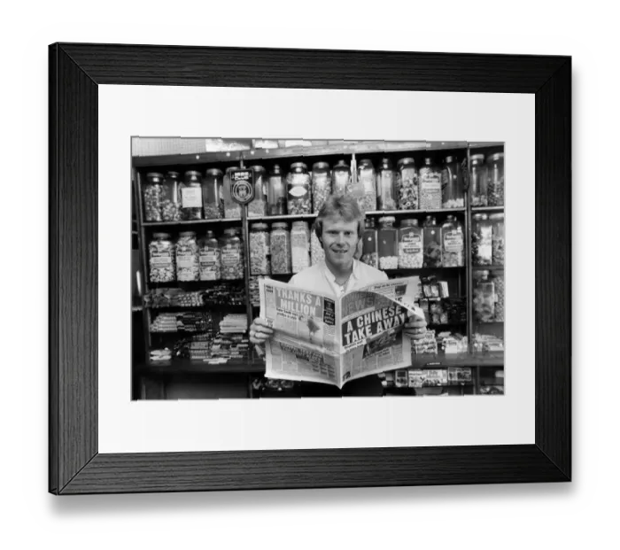Framed Print : Rangers FC new signing Dave MacKinnon catches up on the Ibrox scene at his newsagents