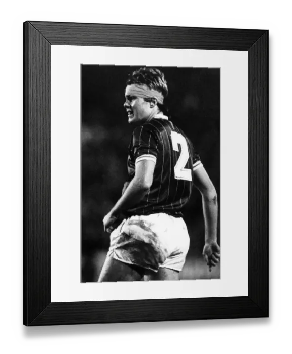 Framed Print : Rangers FC defender Dave MacKinnon, who injured his head against Hearts