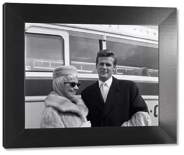 Singer Dorothy Squires returning home from the USA with her husband, actor Roger Moore