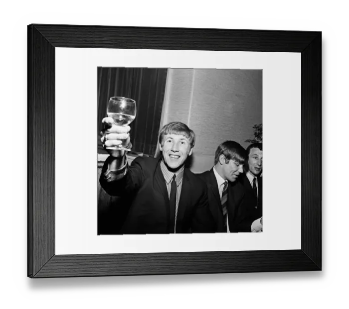 Framed Print : Manchester City players and management staff celebrate with a few drinks