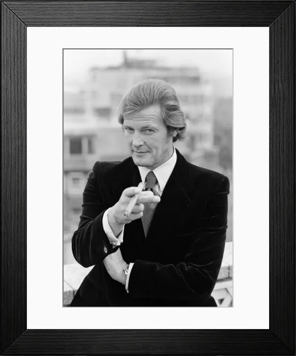 Framed Print : Roger Moore is the new 007. The British actor will make a million pounds for starring in Framed Print : Roger Moore is the new 007. The British actor will make a million pounds for starring in