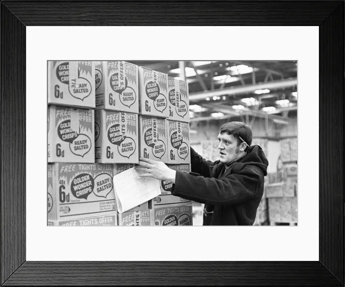 Framed Print : Crisps for Life! A warehouse worker at the Golden Wonder warehouse in Bothwell seen here Framed Print : Crisps for Life! A warehouse worker at the Golden Wonder warehouse in Bothwell seen here