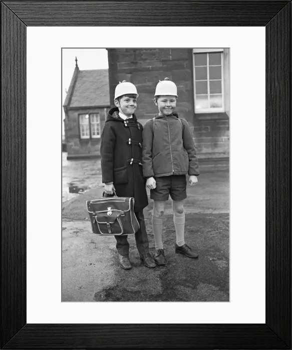 Framed Print : Bright Idea! Two Hamilton schoolboys seen here modelling the latest safety headwear