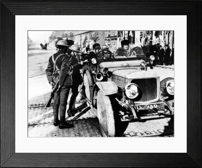 Framed Print : Officers examining the licence of a lady motorist in Dublin. October 1920