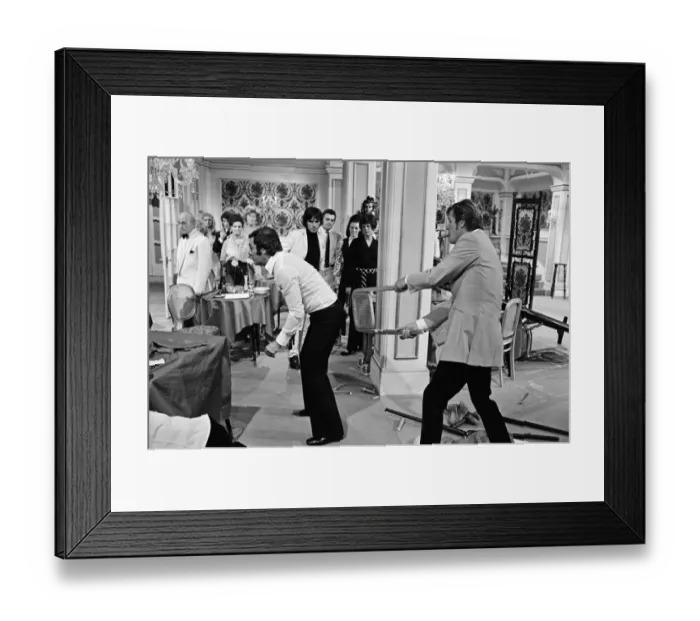 Framed Print : Roger Moore and Tony Curtis fight with each other on the set of The Persuaders Framed Print : Roger Moore and Tony Curtis fight with each other on the set of The Persuaders
