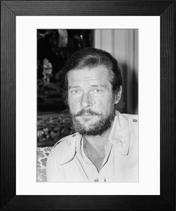 Framed Print : Roger Moore who is in London for the World charity premiere of the new James Bond film