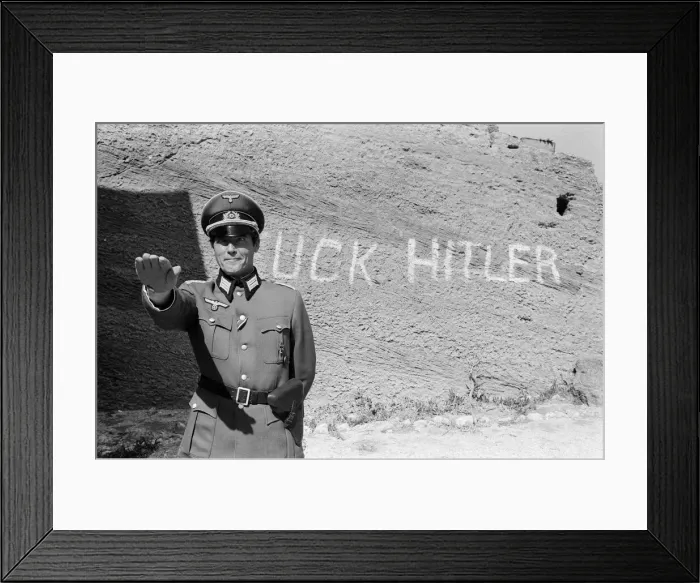 Framed Print : Roger Moore on the set of Escape to Athena in Rhodes, Greece. 8th March 1978 Framed Print : Roger Moore on the set of Escape to Athena in Rhodes, Greece. 8th March 1978