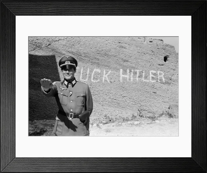 Framed Print : Roger Moore on the set of Escape to Athena in Rhodes, Greece. 8th March 1978 Framed Print : Roger Moore on the set of Escape to Athena in Rhodes, Greece. 8th March 1978