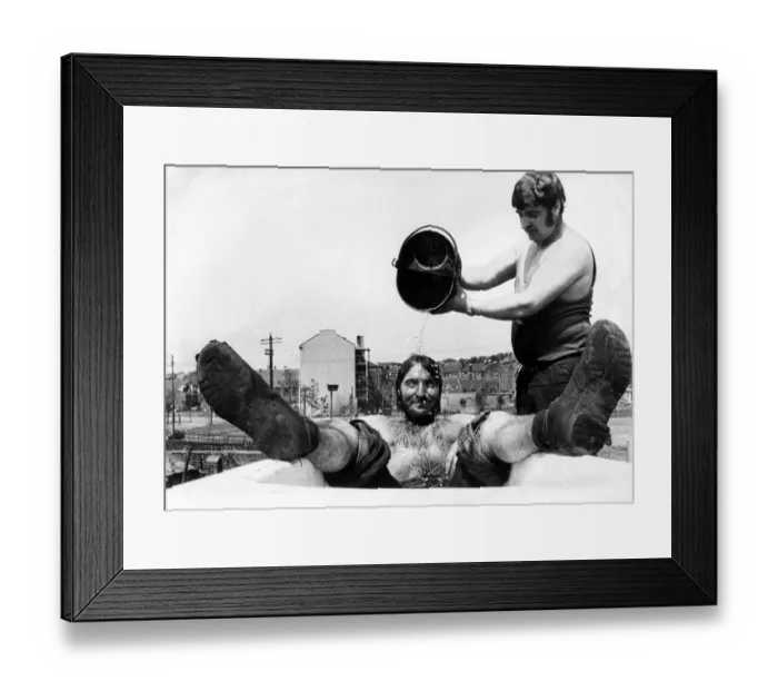 Framed Print : Shifting tons of scrap metal is no joke when the temperature is hitting the 80s