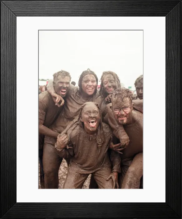 Framed Print : Fans covered in mud, at Margam Park to watch Catatonia performing, South Wales