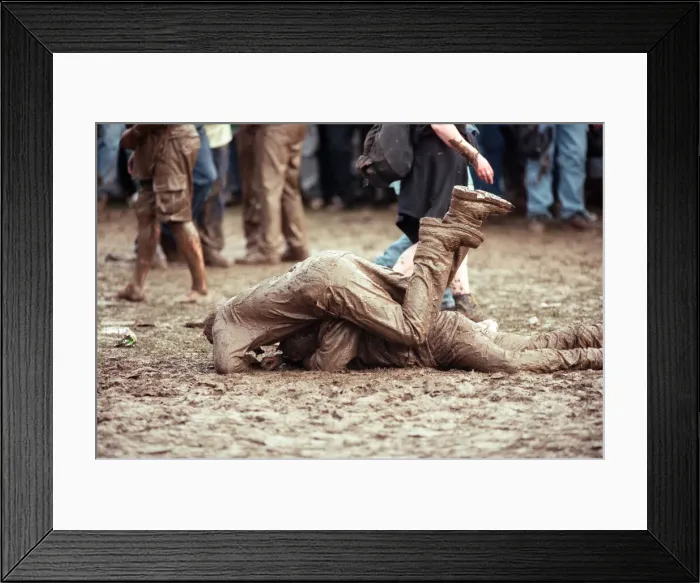 Framed Print : Fans covered in mud, at Margam Park to watch Catatonia performing, South Wales