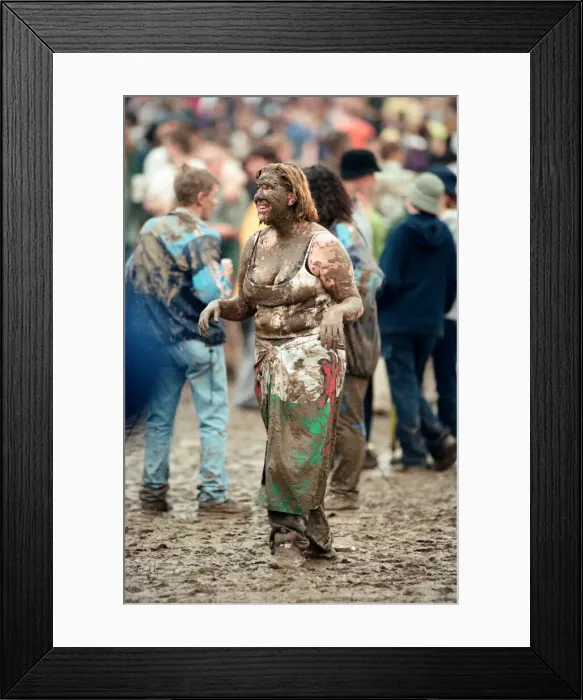 Framed Print : Fans covered in mud, at Margam Park to watch Catatonia performing, South Wales
